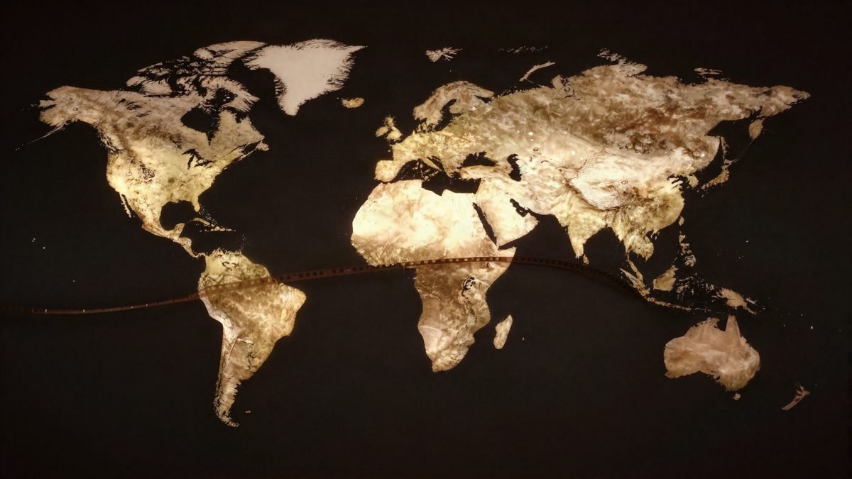 A world map with a strip of film reel conveying global series